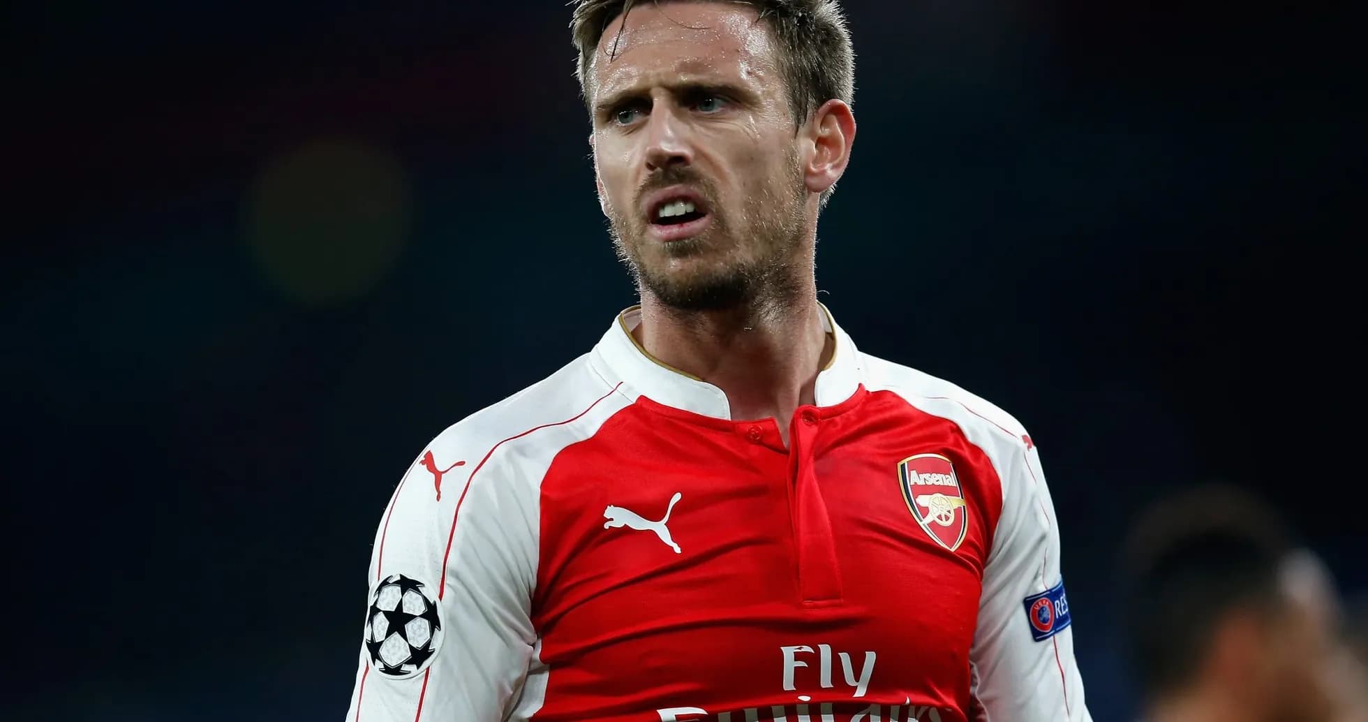 Player wearing Arsenal jersey during a match