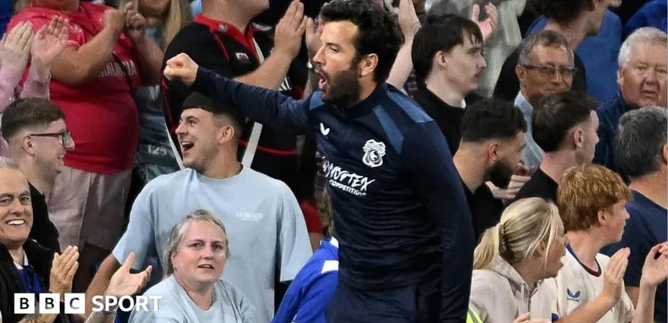 Player celebrating with fans in the stands