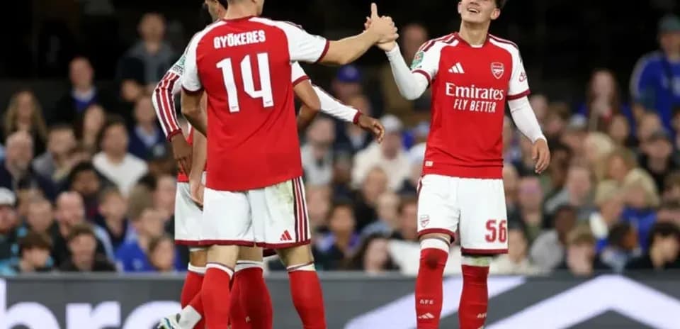 Arsenal players celebrating on the field during match