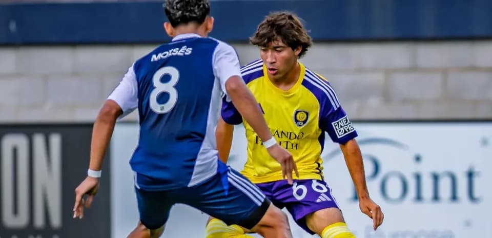 Two players competing in MLS Next Pro match