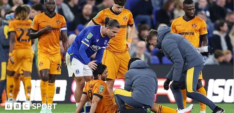 Player receiving medical attention on the pitch
