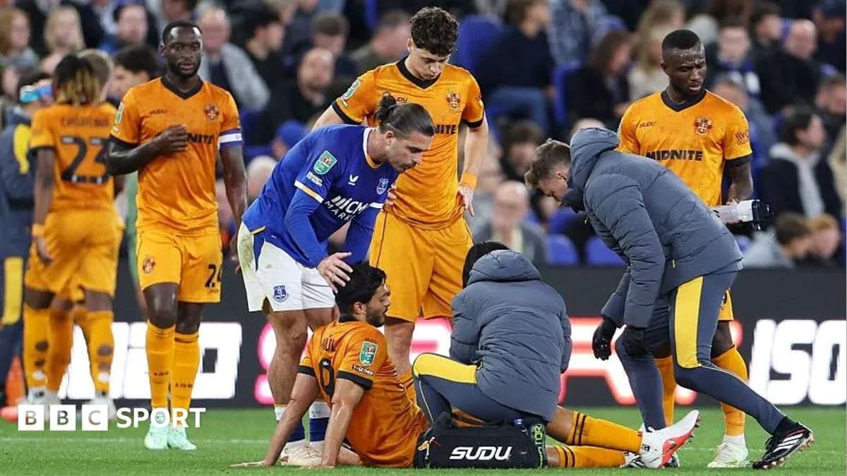 Player receiving medical attention on the pitch