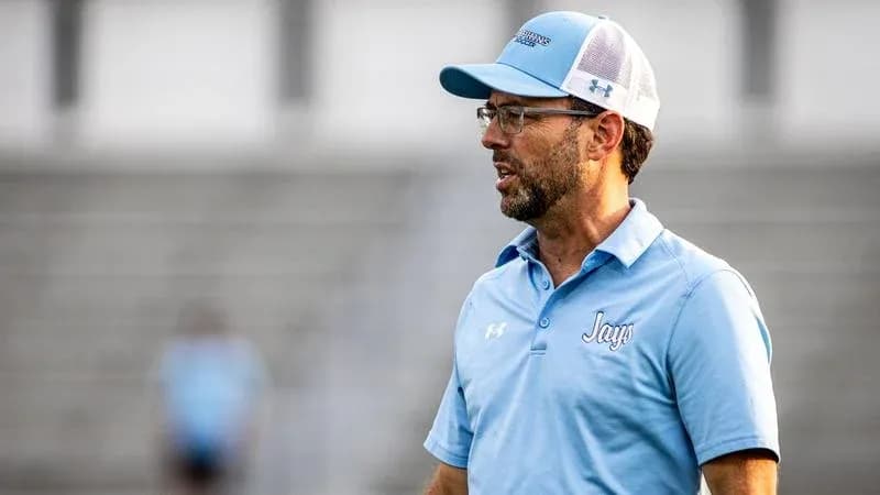 Coach talking on the sidelines during practice