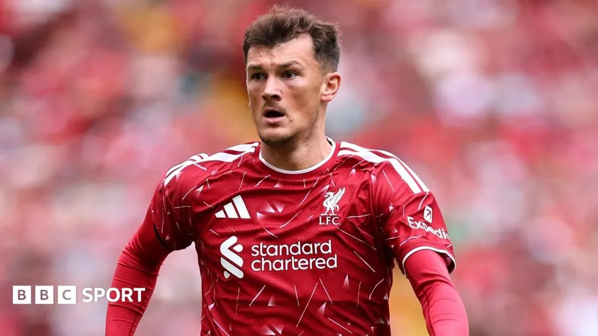 Liverpool player in red kit during match action