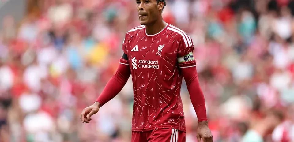 Liverpool player walking on the pitch during match