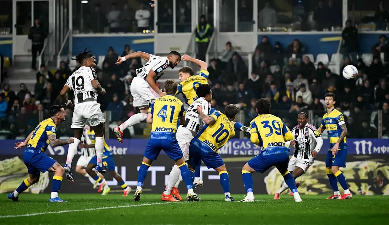 Juventus player heading the ball against Parma