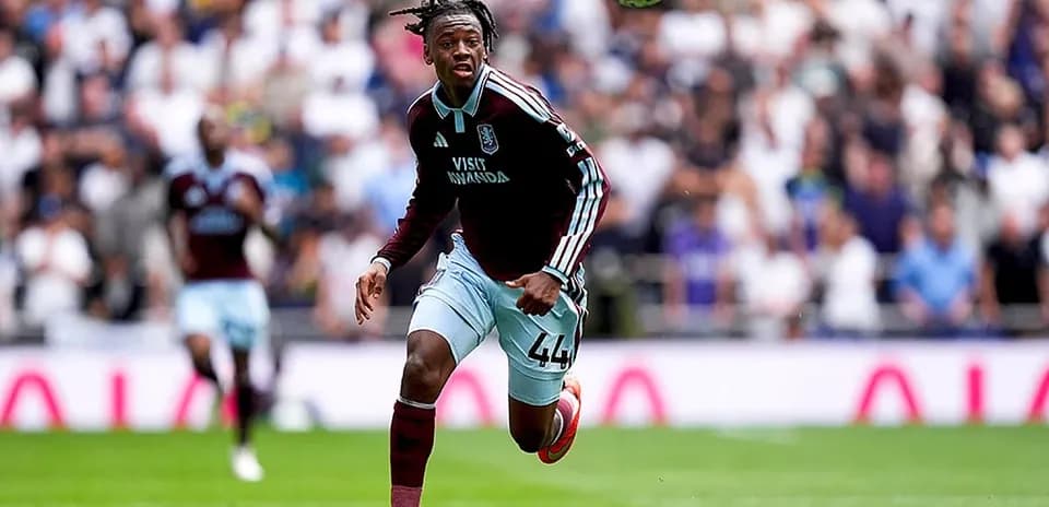 Aston Villa player chasing the ball during match