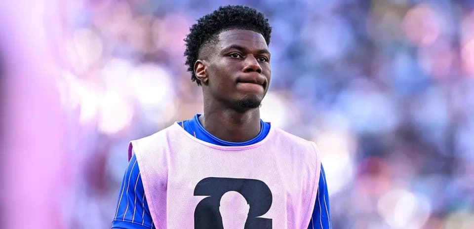 Player wearing training bib on sidelines during match