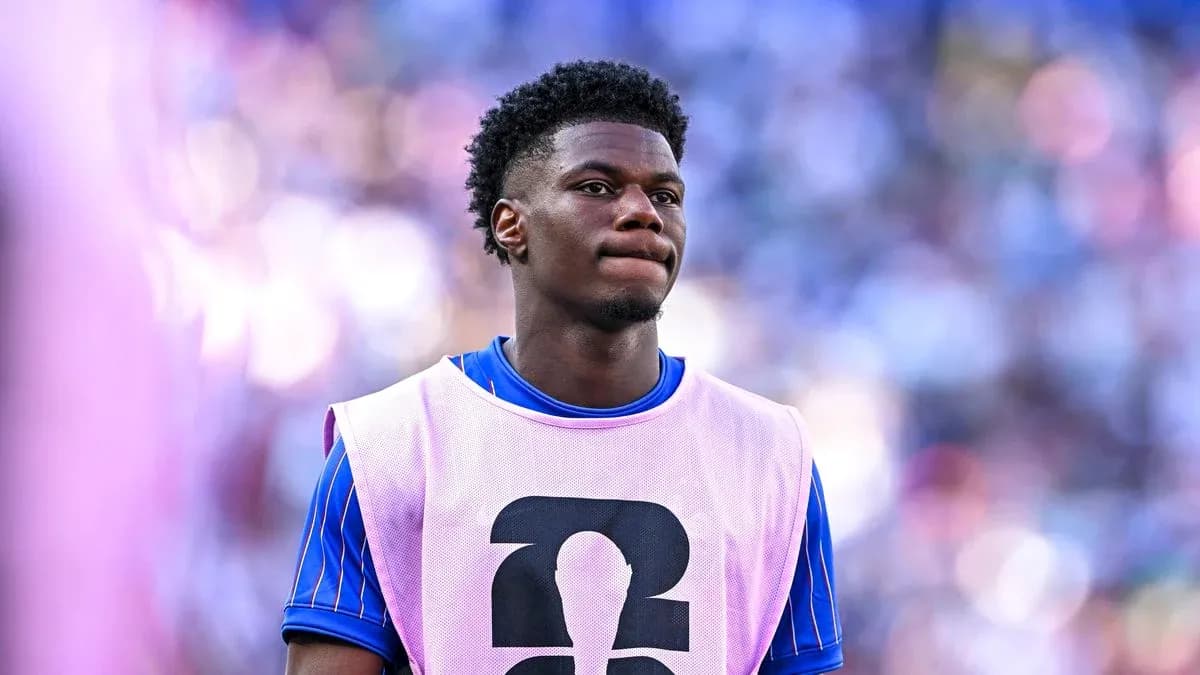 Player wearing training bib on sidelines during match
