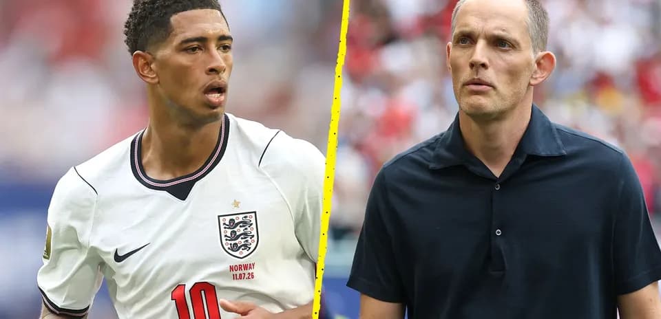 Football player in England kit and coach on sideline