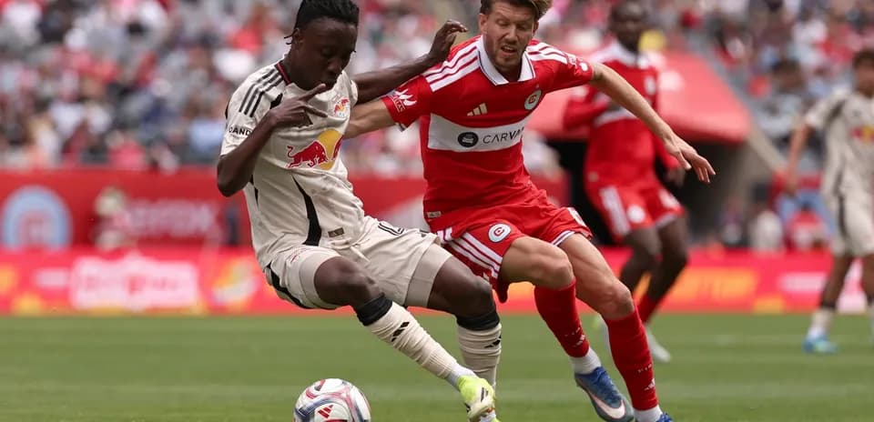 New York Red Bulls player tackles Chicago Fire opponent