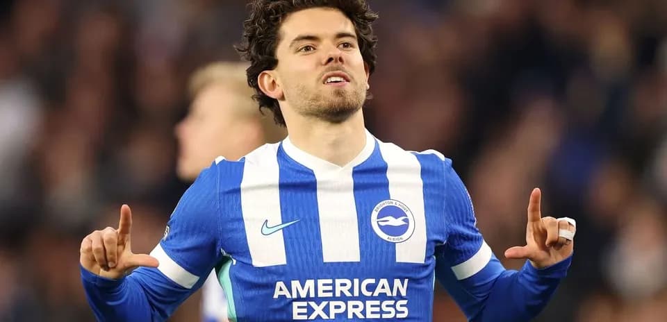 Player celebrating a goal in Brighton kit