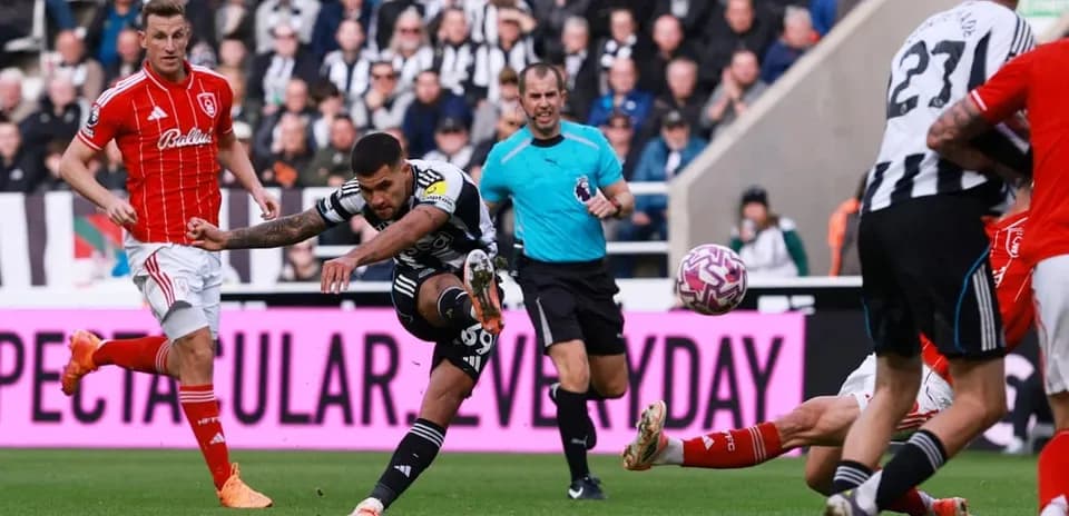 Player striking the ball during Nottingham Forest vs Newcastle
