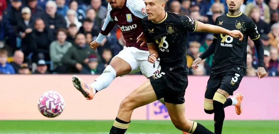 Aston Villa player kicking ball against Burnley