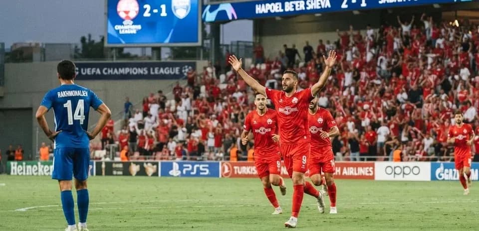 Hapoel Beer Sheva players celebrating goal against Sabah FA