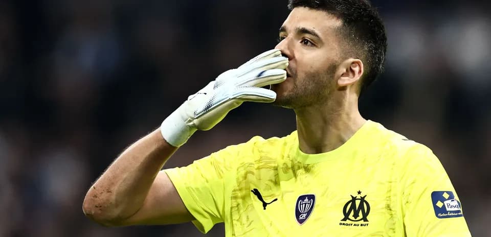 Goalkeeper celebrating after a match in yellow kit