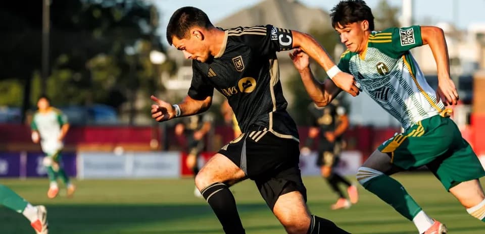 Player dribbling the ball during MLS Next Pro match