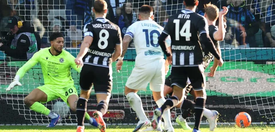Udinese goalkeeper reacts to shot on goal