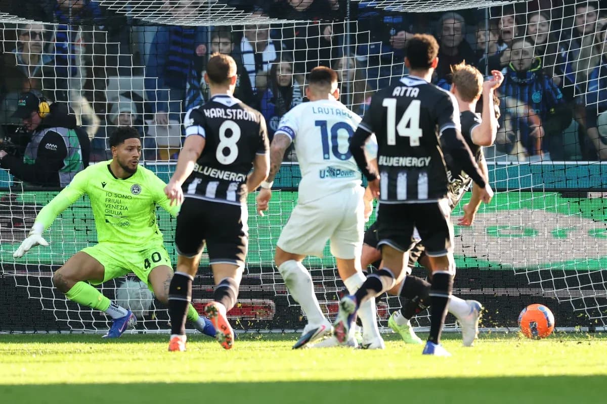 Udinese goalkeeper reacts to shot on goal