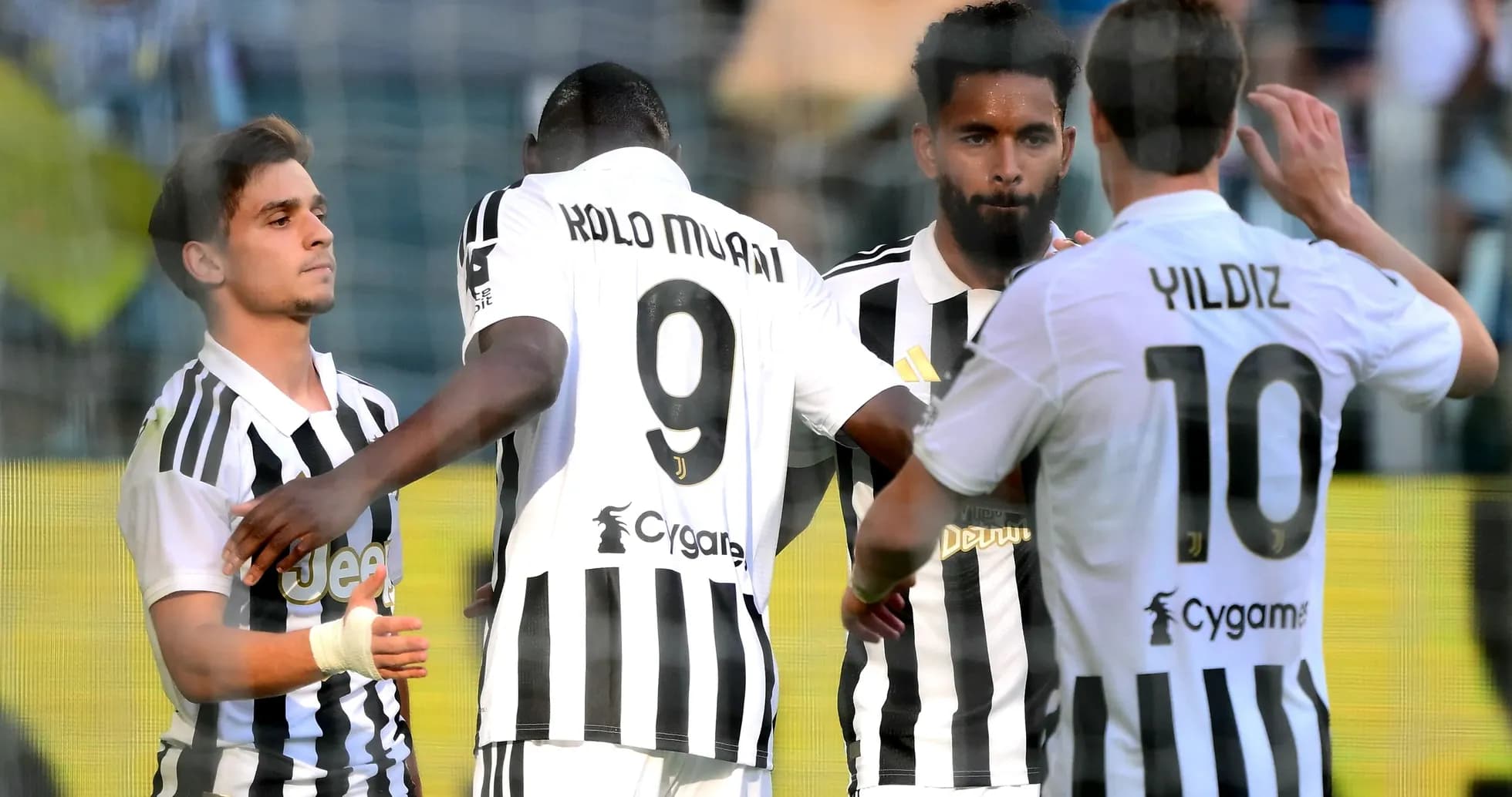Juventus players celebrating a goal on the pitch