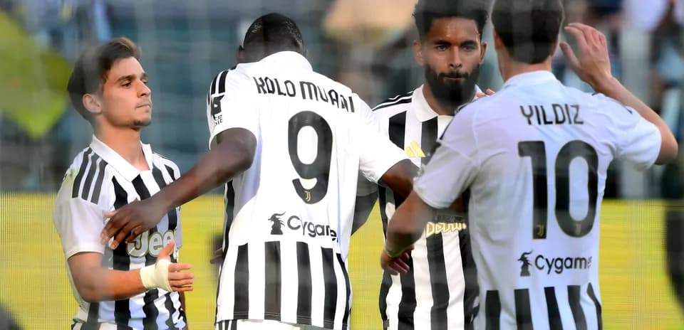 Juventus players celebrating a goal on the pitch