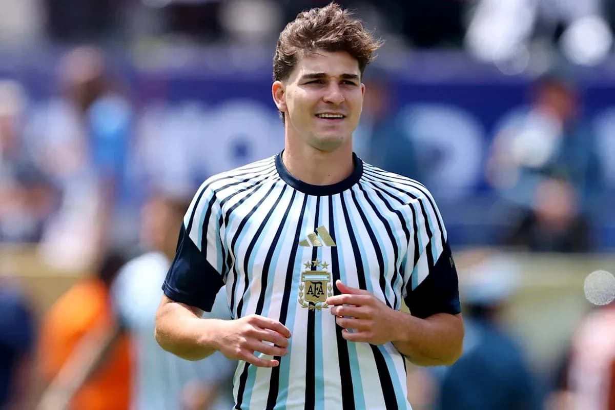 Player wearing striped Argentine jersey on field