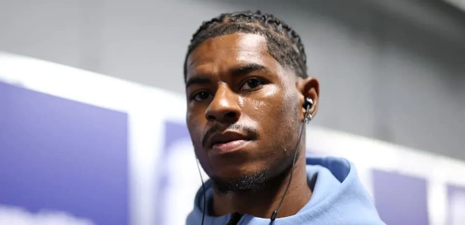 Player wearing headphones in hallway before match