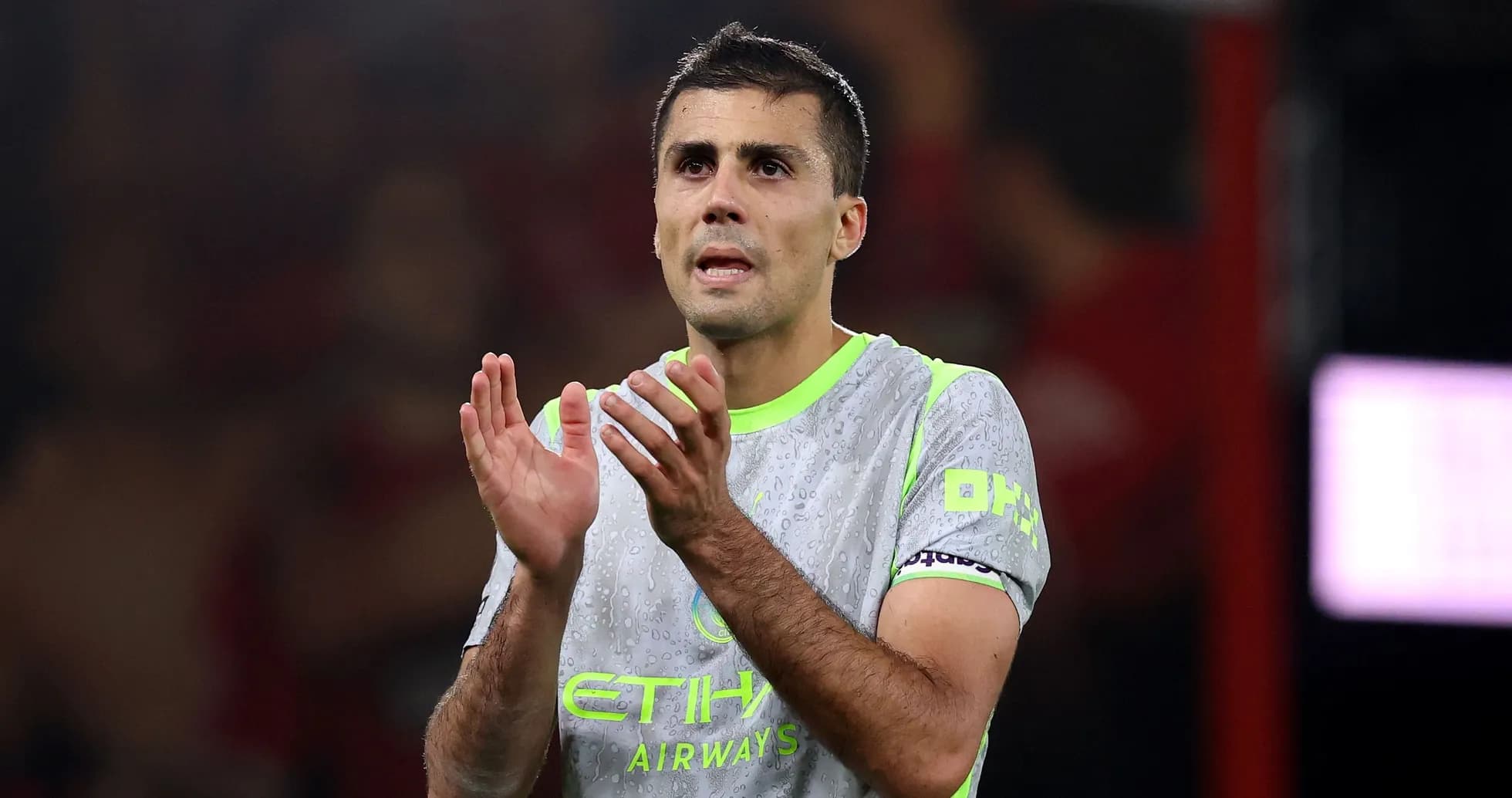 Player applauding after match wearing Manchester City kit