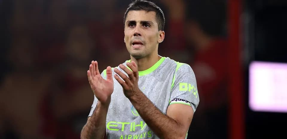 Player applauding after match wearing Manchester City kit