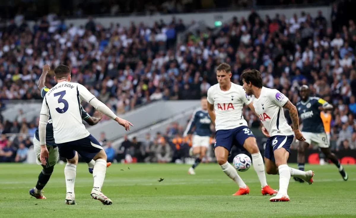 Players from Tottenham defending against an attacking player