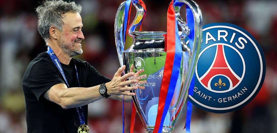 Coach celebrating with Champions League trophy and medal