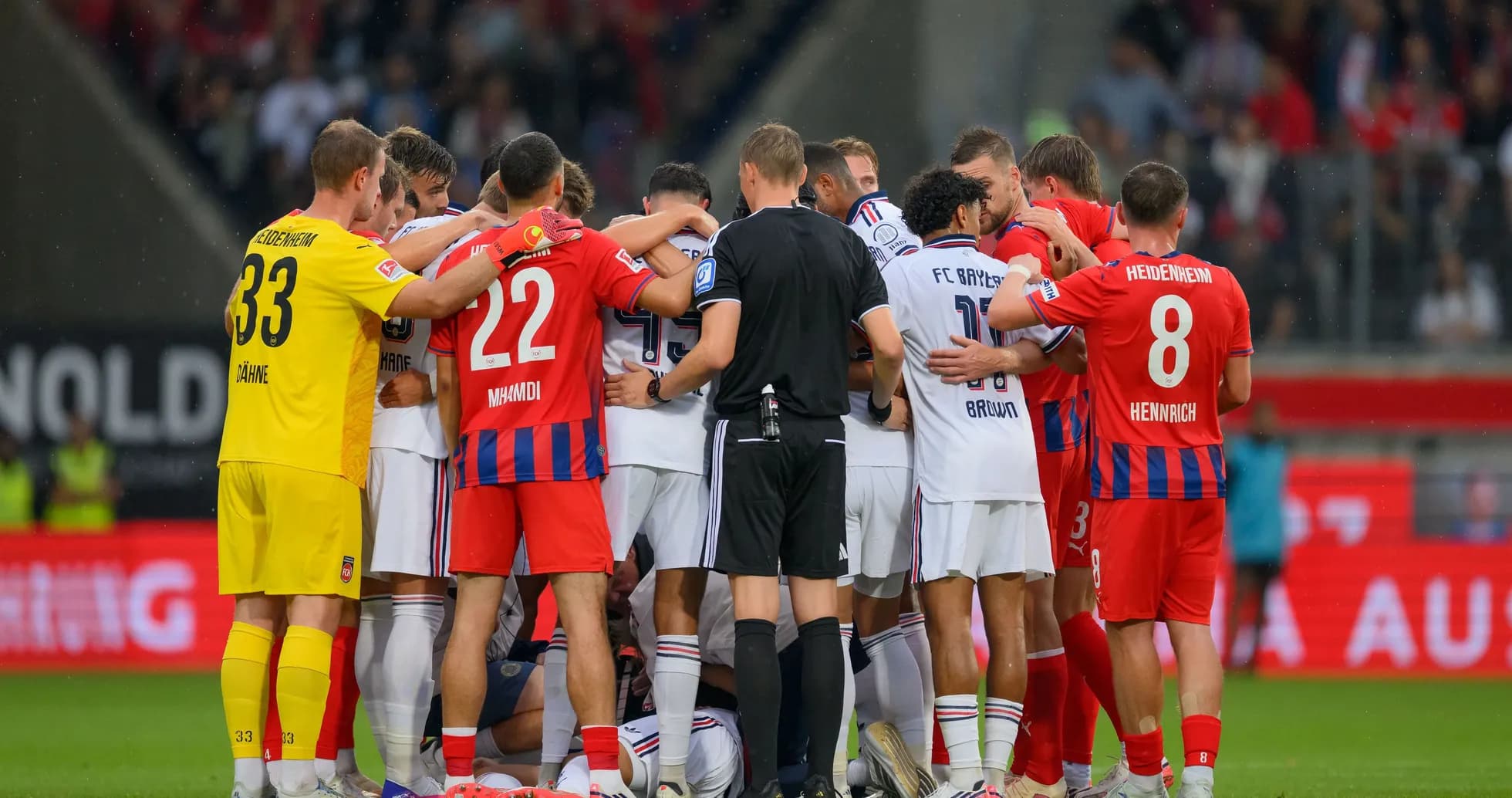 Players from both teams huddled during a match