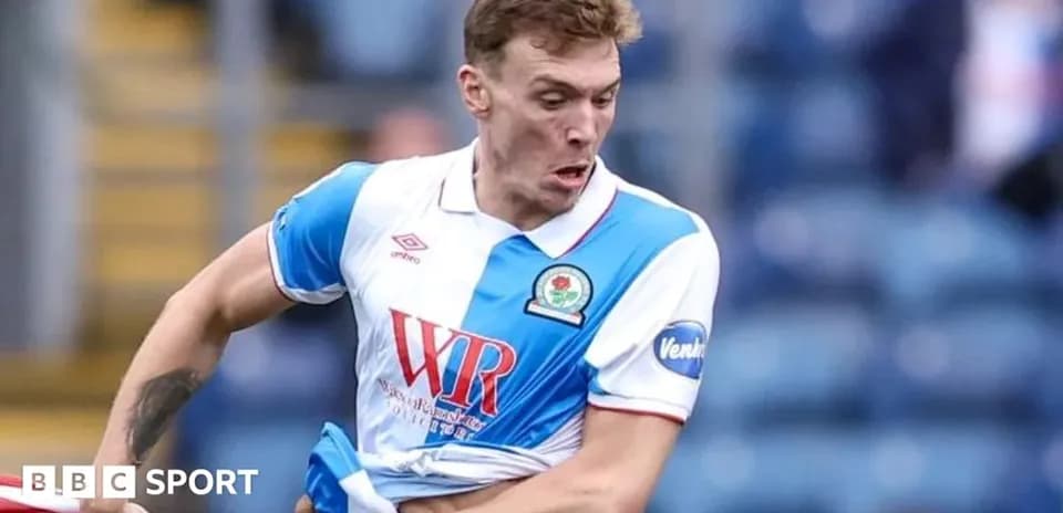 Player in Blackburn Rovers kit during match action