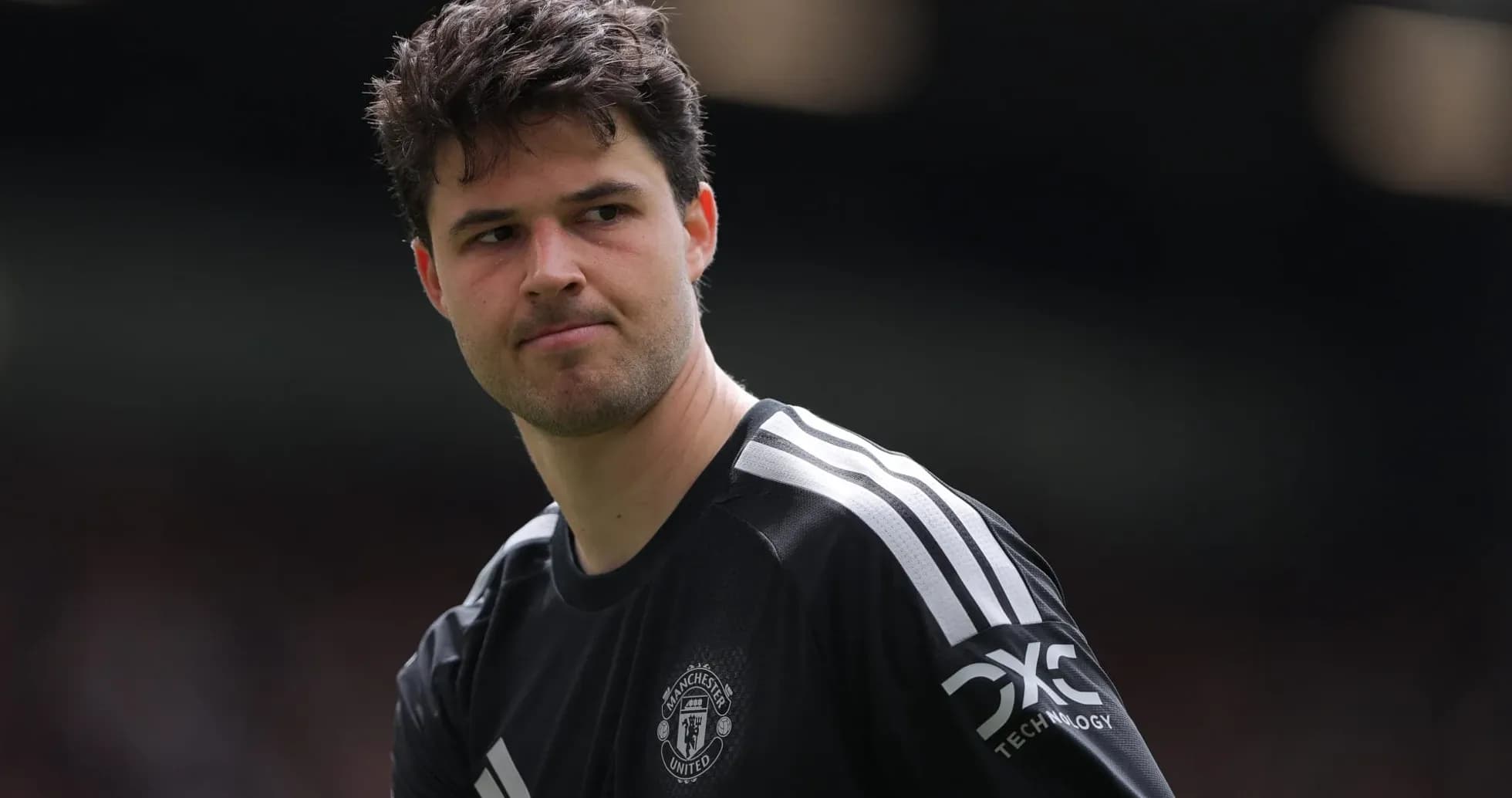 Goalkeeper in Manchester United kit on the field