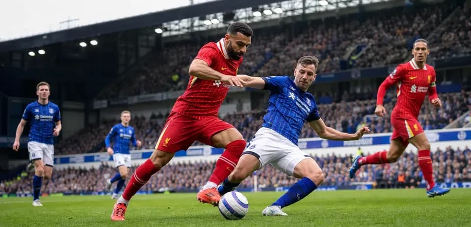 Players competing for the ball in Liverpool vs Everton match
