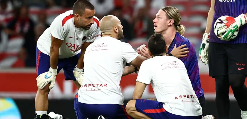 Medical staff attending to player on the field