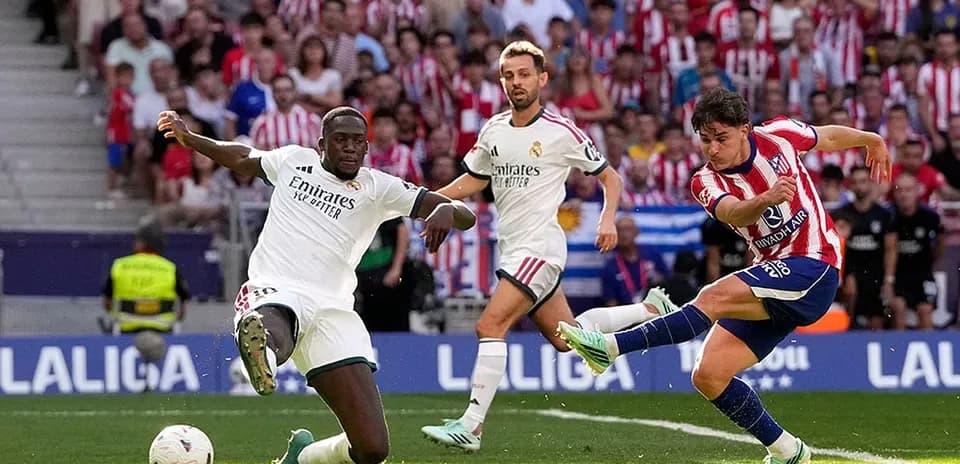 Atletico player shooting during Madrid derby