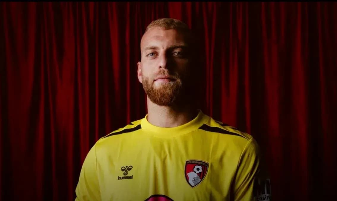 Goalkeeper posing in AFC Bournemouth jersey