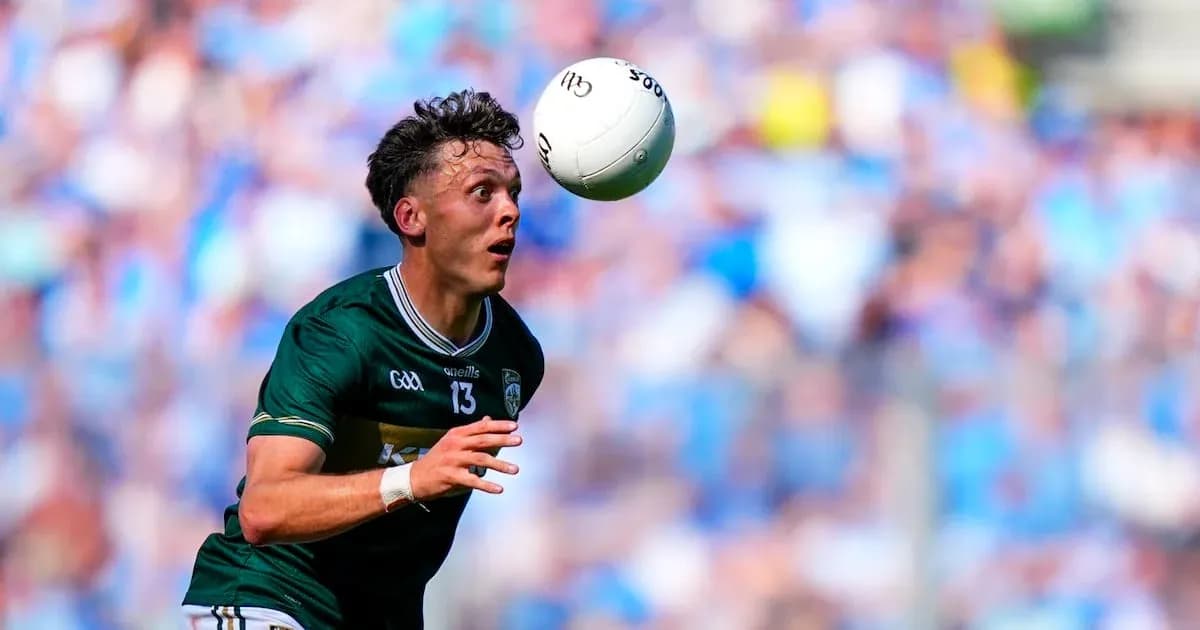 Player attempting to catch a football during match