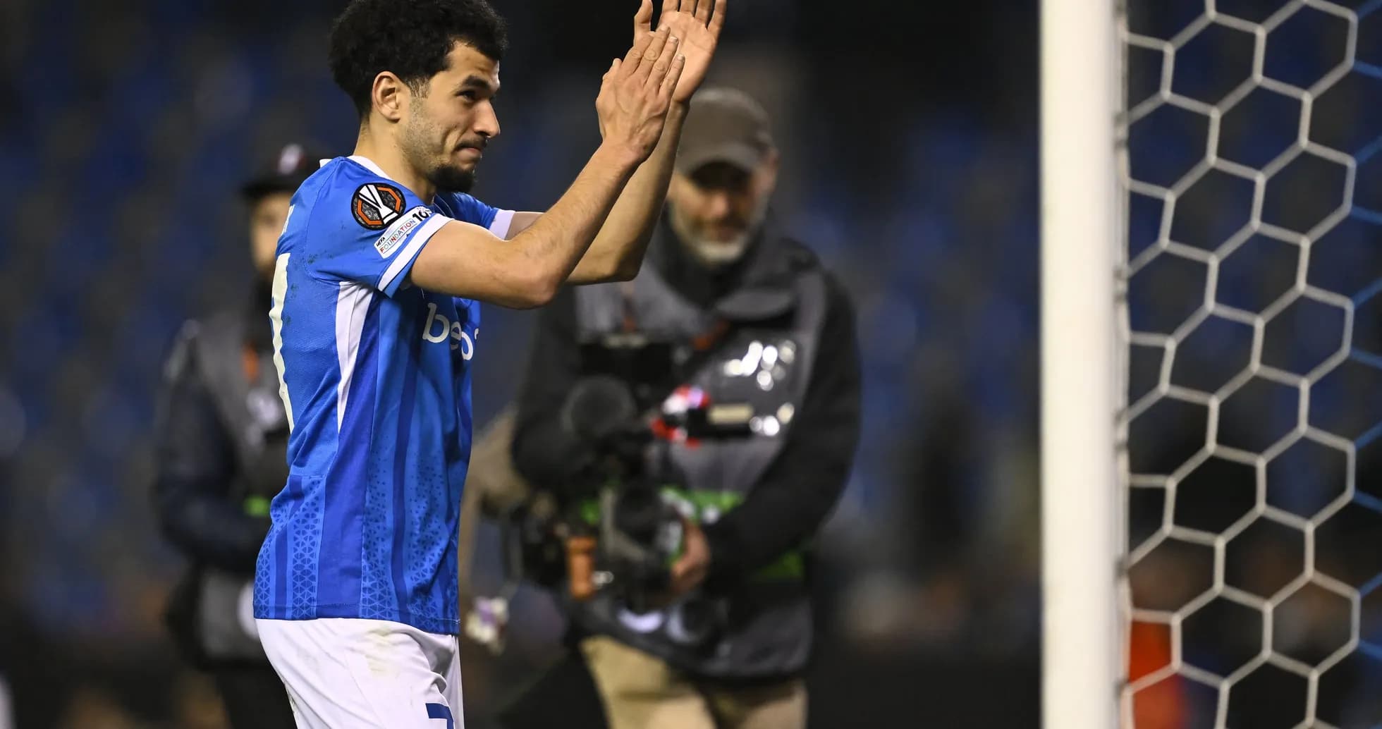 Player applauding fans after the match