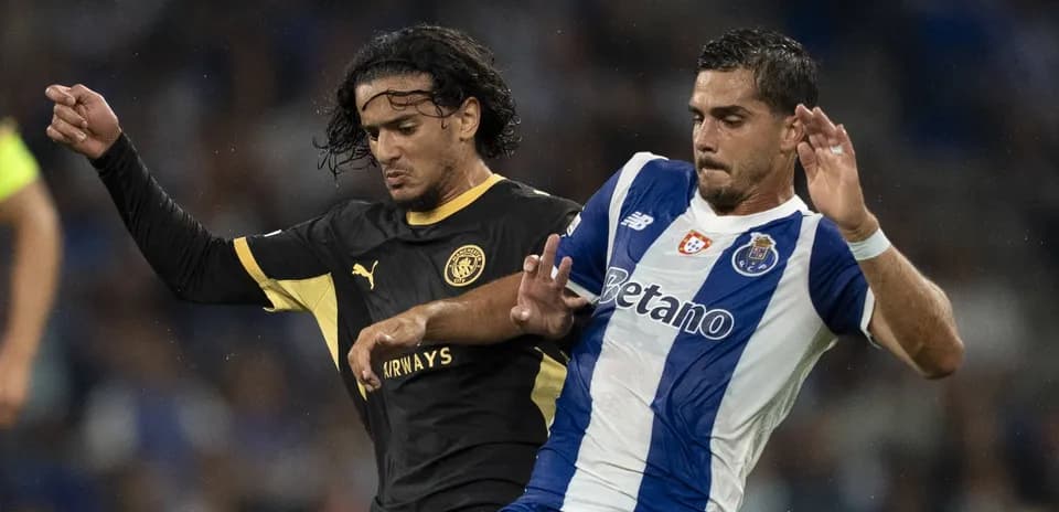 Two players battling for the ball during match