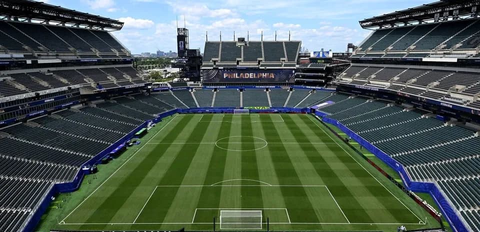Empty soccer stadium with field and seating areas