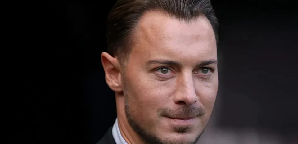 Man in a suit looking at the camera