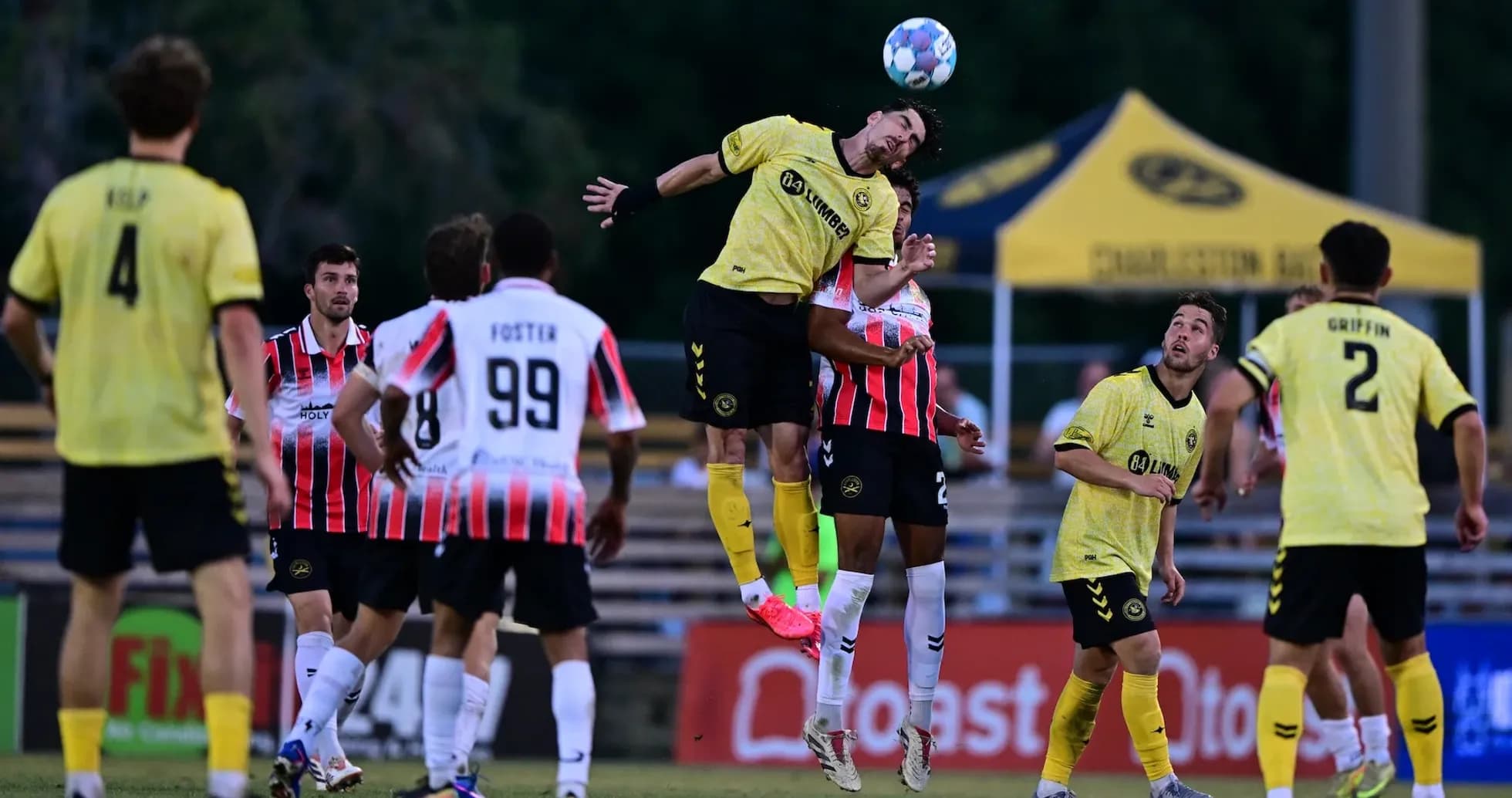 Player heading the ball during Charleston Battery match