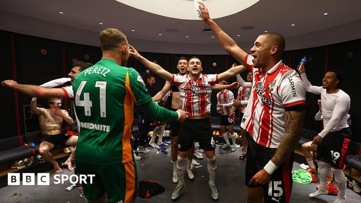 Players celebrating in locker room after match