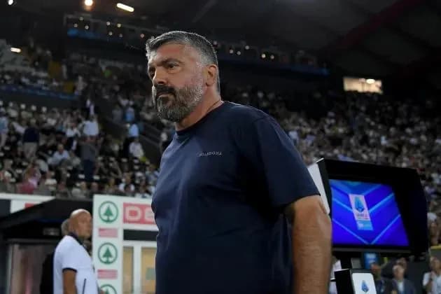 Coach standing on the sidelines during match