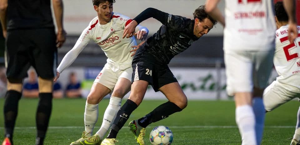 Players competing for the ball during Oberliga match