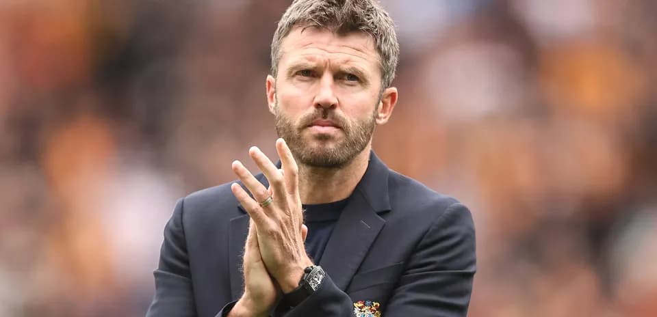 Manager applauding during match at stadium