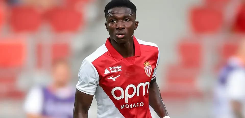 Monaco player in red and white kit during match
