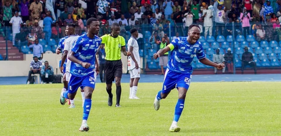 Players celebrating a goal during Warri Wolves match
